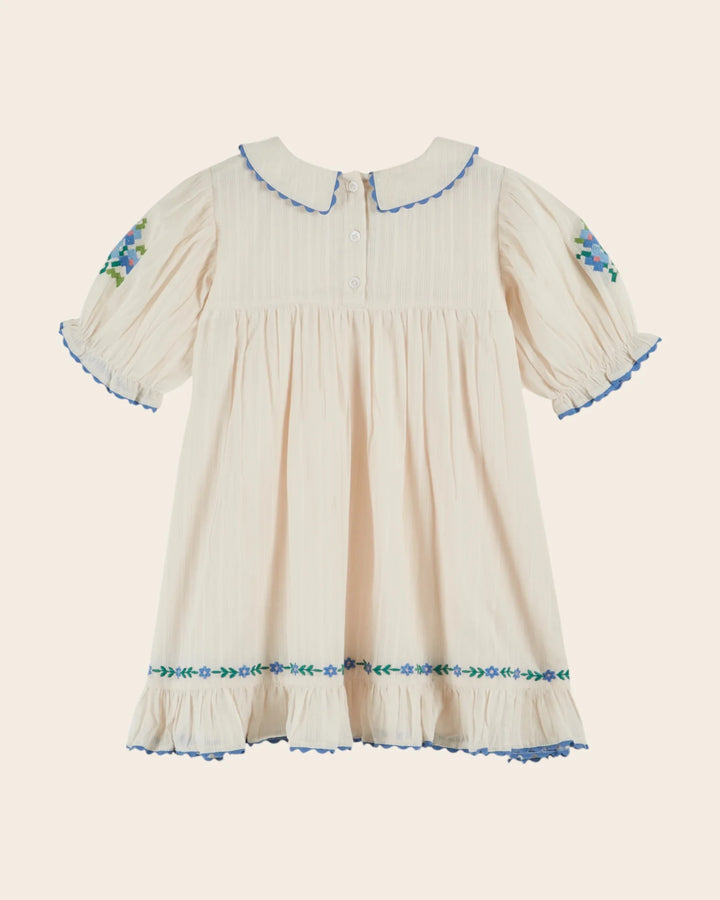 girls cream embroidered cotton dress with blue scalloped trim
