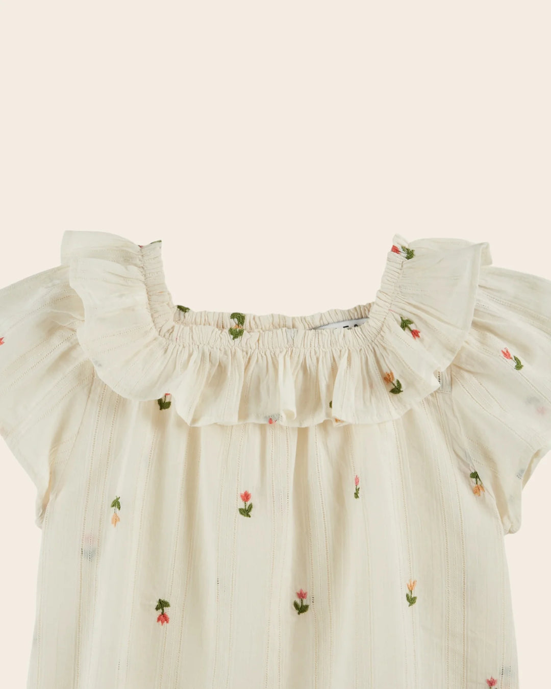 girl embroidered cotton blouse with ruffled neckline in cream

