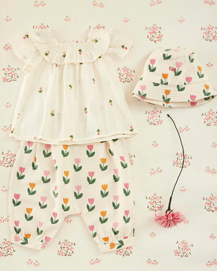 baby girl embroidered cotton blouse with ruffled neckline in cream
