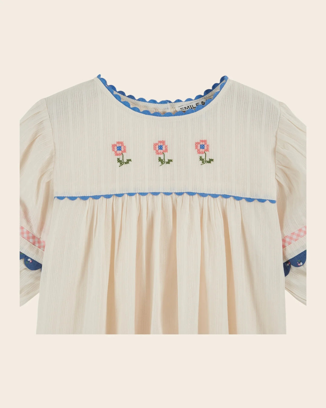 girls cream embroidered cotton blouse with blue trim
