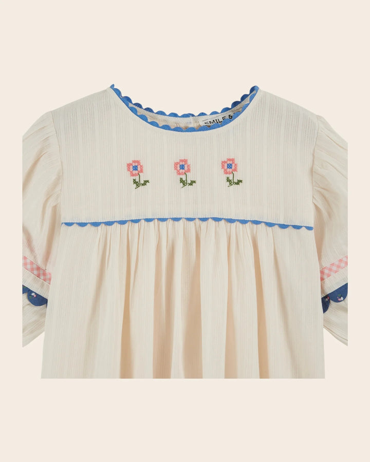 girls cream embroidered cotton blouse with blue trim
