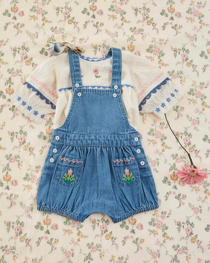 girls cream embroidered cotton blouse with blue trim
