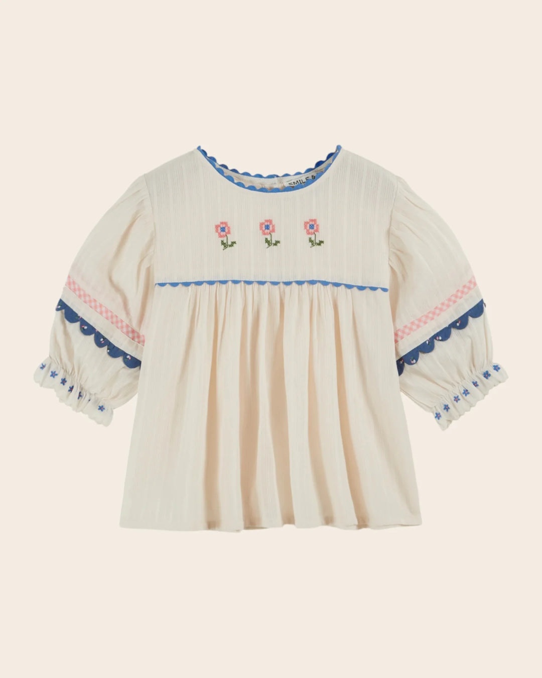 girls cream embroidered cotton blouse with blue trim
