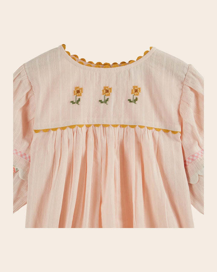 girls pink embroidered cotton blouse with blue trim
