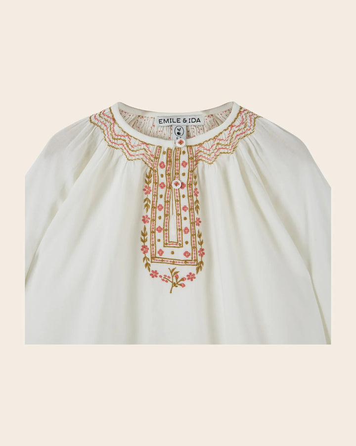 Close-up of embroidery on the Emile et Ida girls ecru blouse, highlighting its decorative detailing.