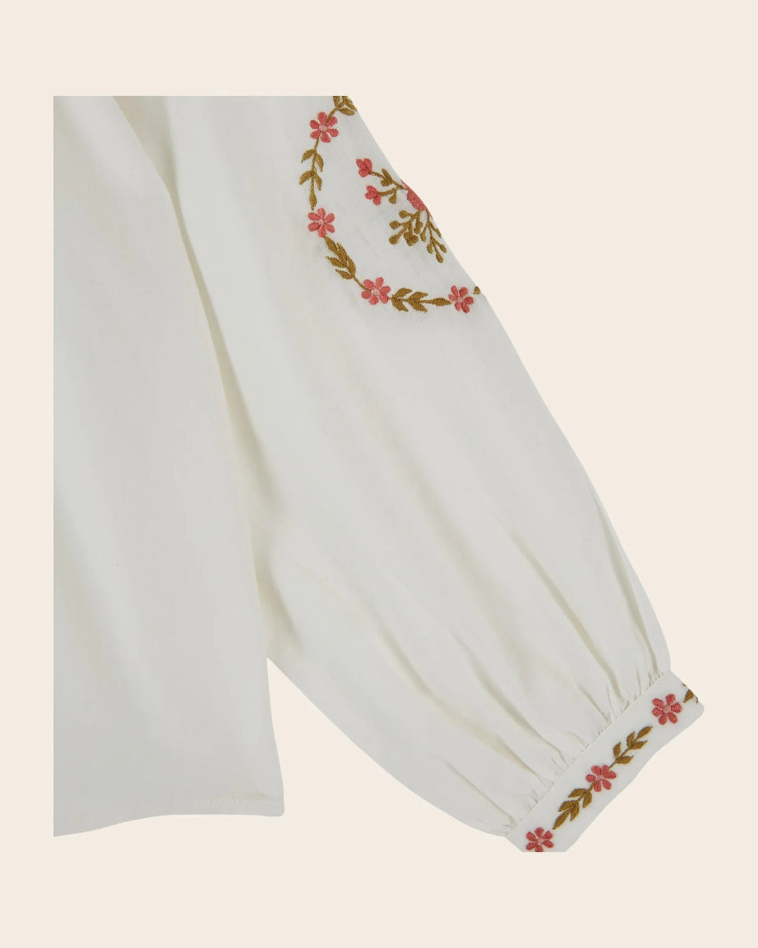 Close-up of embroidery on the Emile et Ida girls ecru blouse, highlighting its decorative detailing.