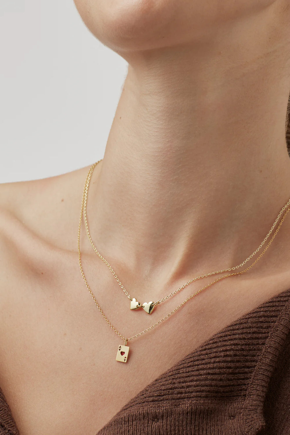 Estella Bartlett gold plated ace of hearts charm necklace