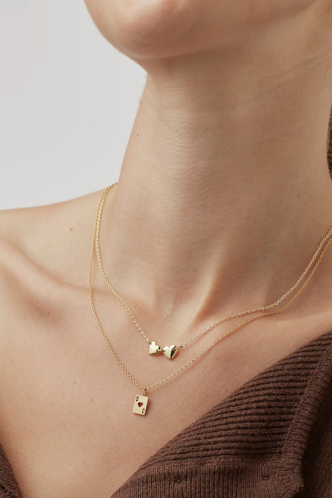 Estella Bartlett gold plated ace of hearts charm necklace