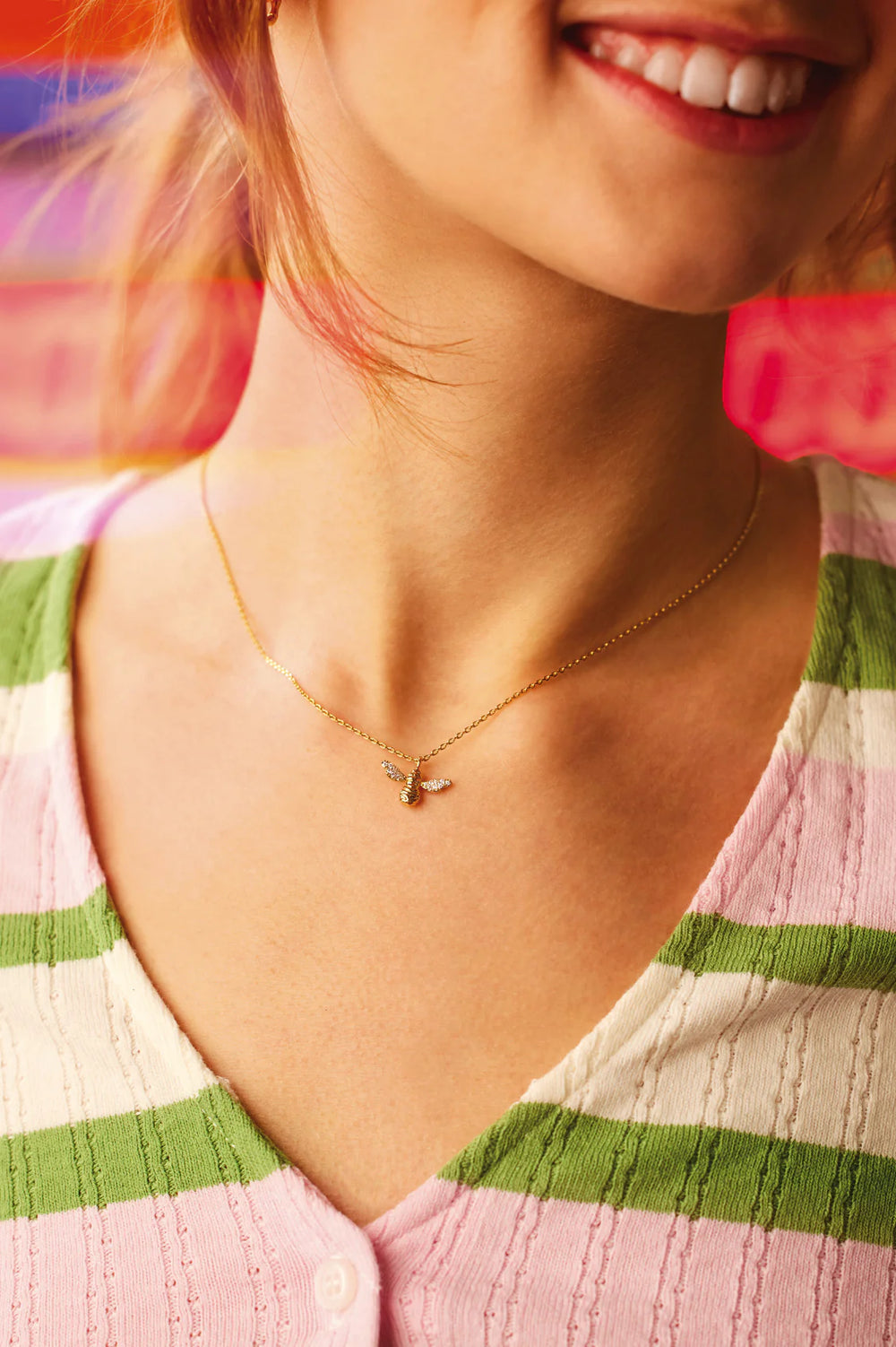 Estella Bartlett gold plated bee pendant necklace with cubic zirconia wings