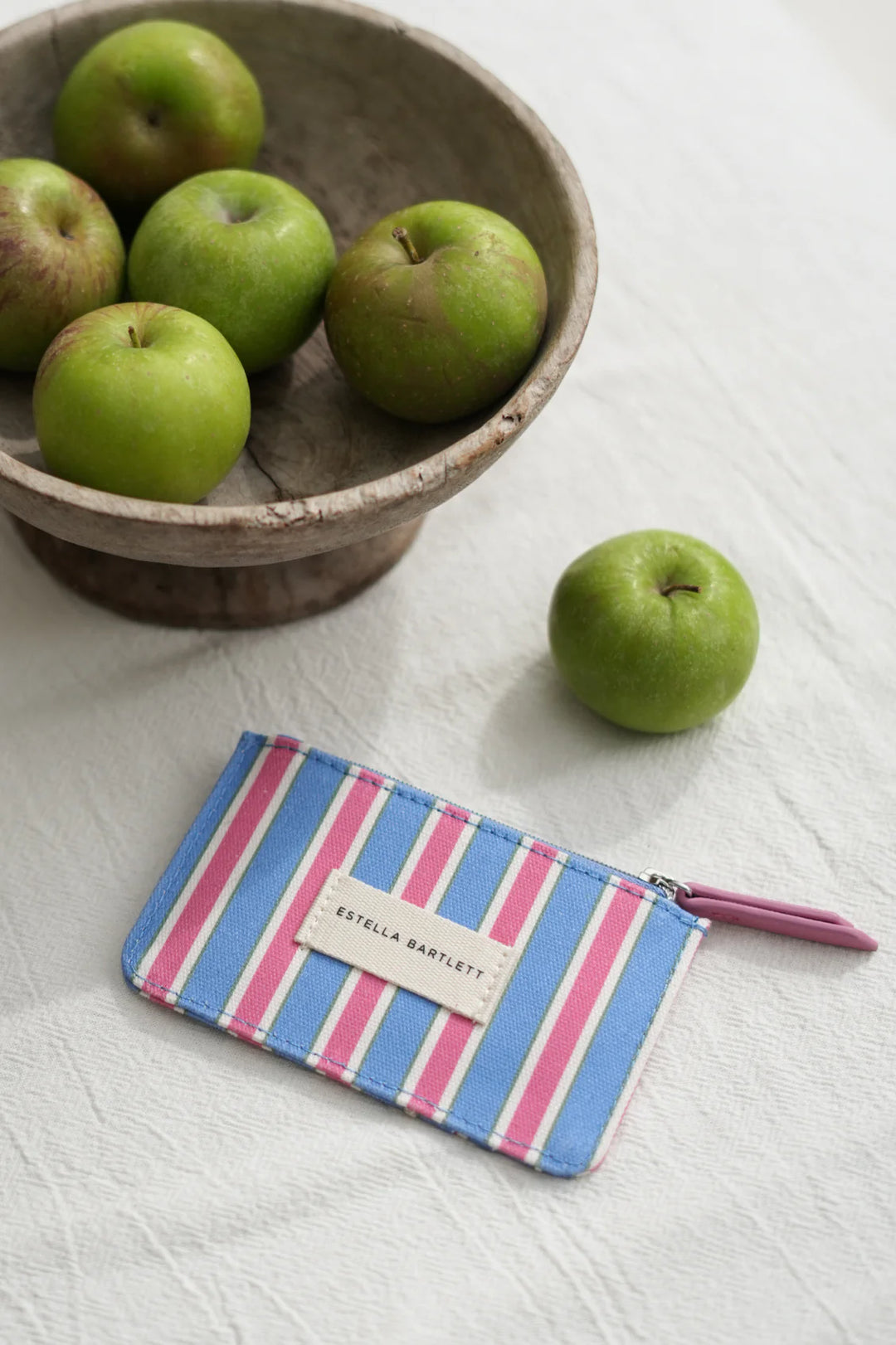 Estella Bartlett blue striped card purse with zip fastening and colourful stripe design