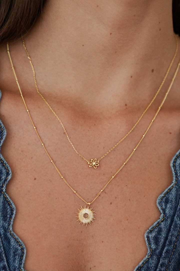 Estella Bartlett gold plated sunburst pendant necklace on delicate chain