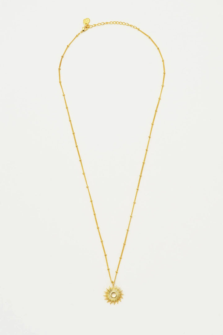 Estella Bartlett gold plated sunburst pendant necklace on delicate chain