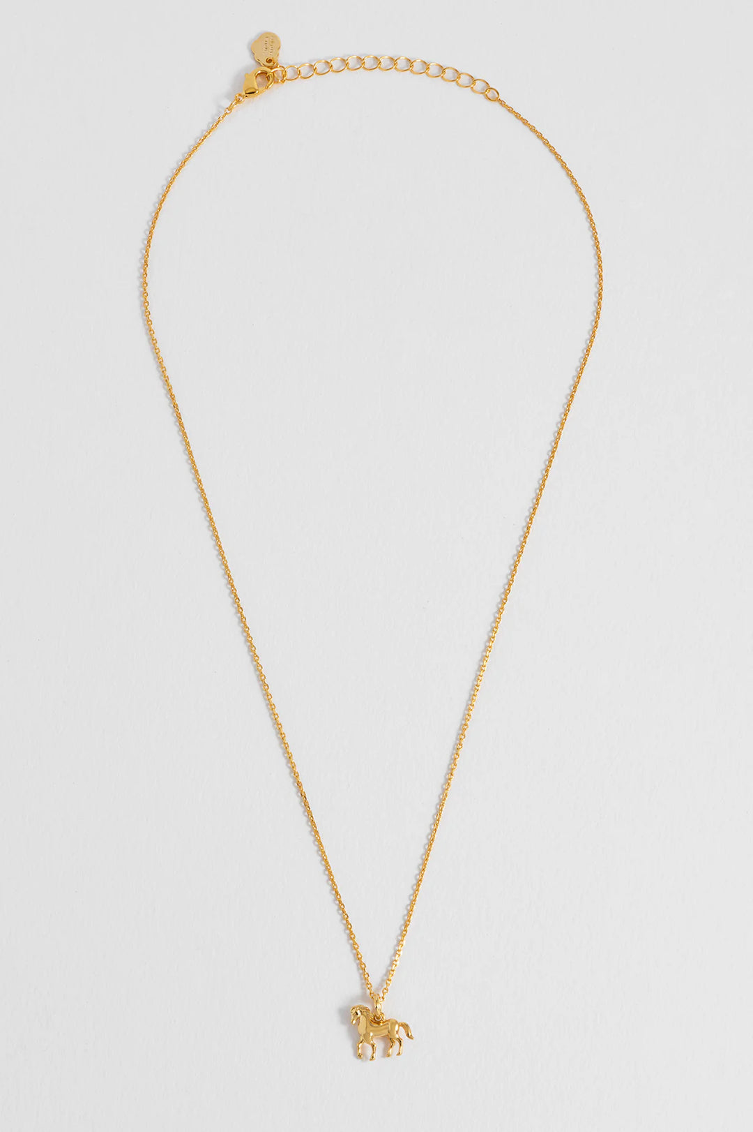 Estella Bartlett gold plated horse charm necklace on a delicate chain