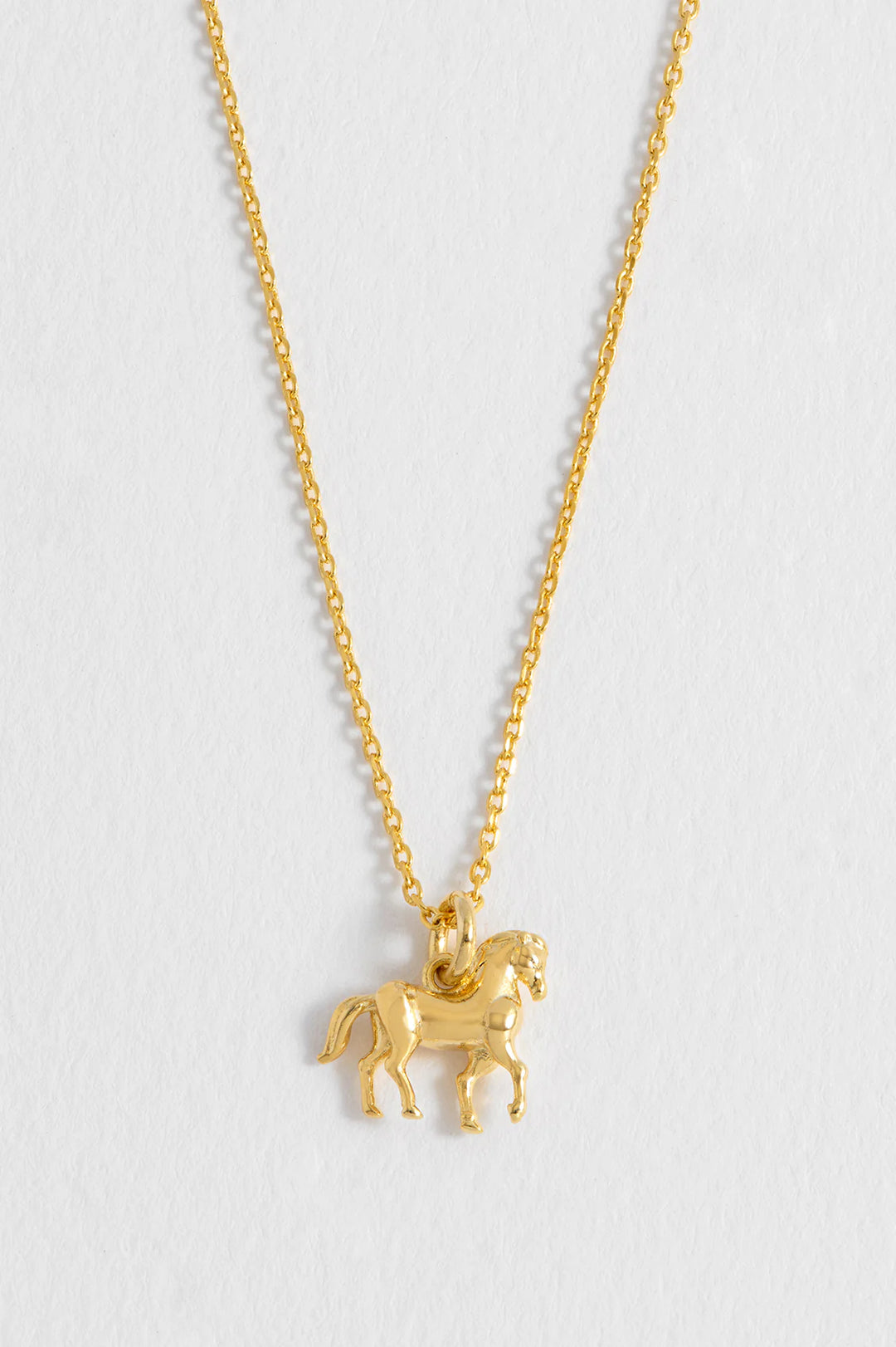 Estella Bartlett gold plated horse charm necklace on a delicate chain