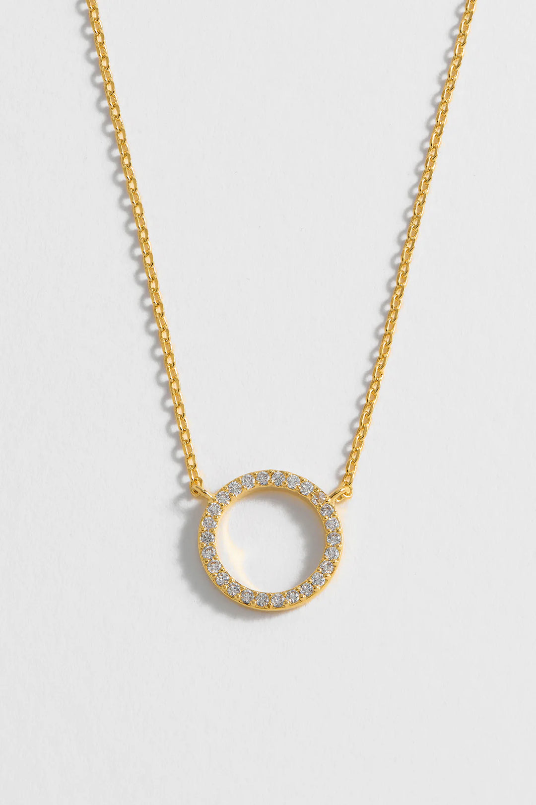 Estella Bartlett gold plated pave circle necklace with cubic zirconia stones