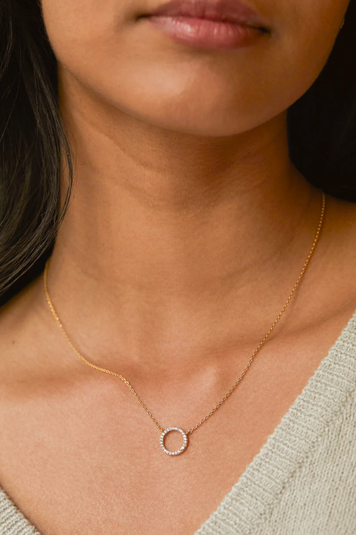 Estella Bartlett gold plated pave circle necklace with cubic zirconia stones
