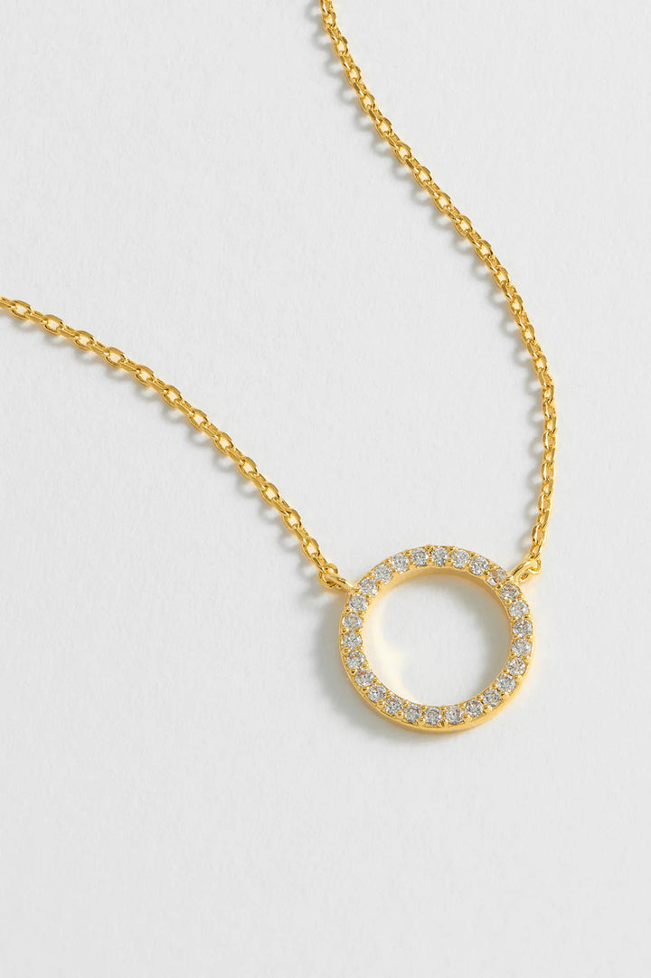Estella Bartlett gold plated pave circle necklace with cubic zirconia stones