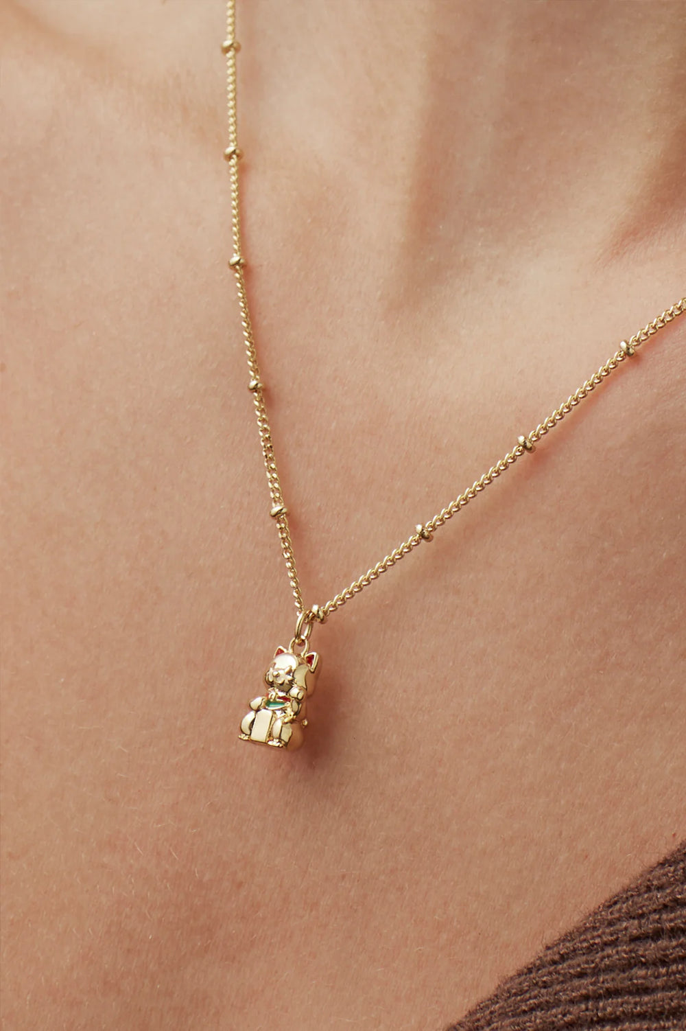 Estella Bartlett gold plated lucky cat charm necklace
