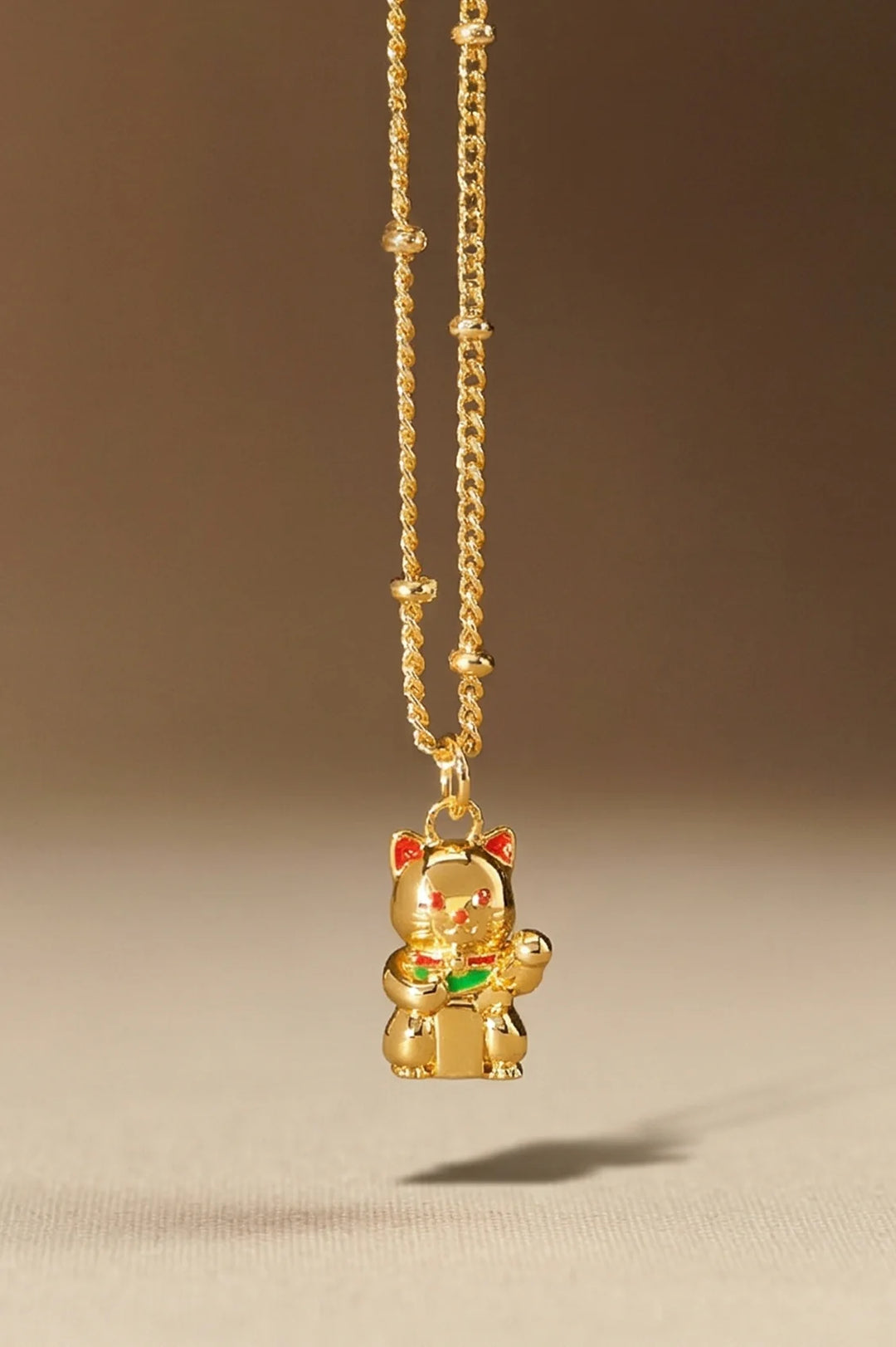 Estella Bartlett gold plated lucky cat charm necklace