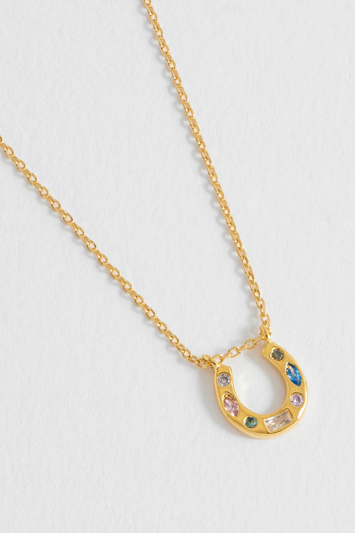 Estella Bartlett gold plated horseshoe necklace with pastel cubic zirconia charms