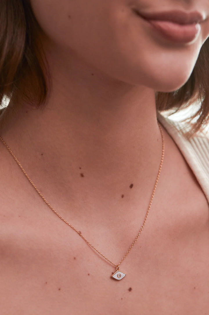 Estella Bartlett gold plated evil eye necklace with pearl detail