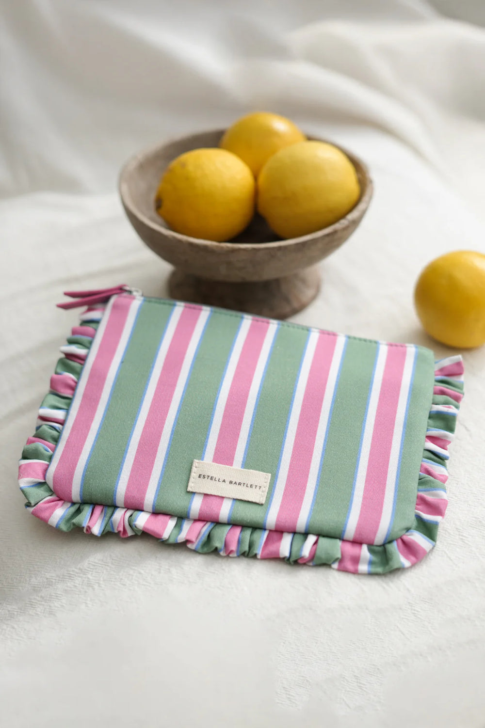 Estella Bartlett blue stripe ruffle pouch with colourful striped design and frill edging