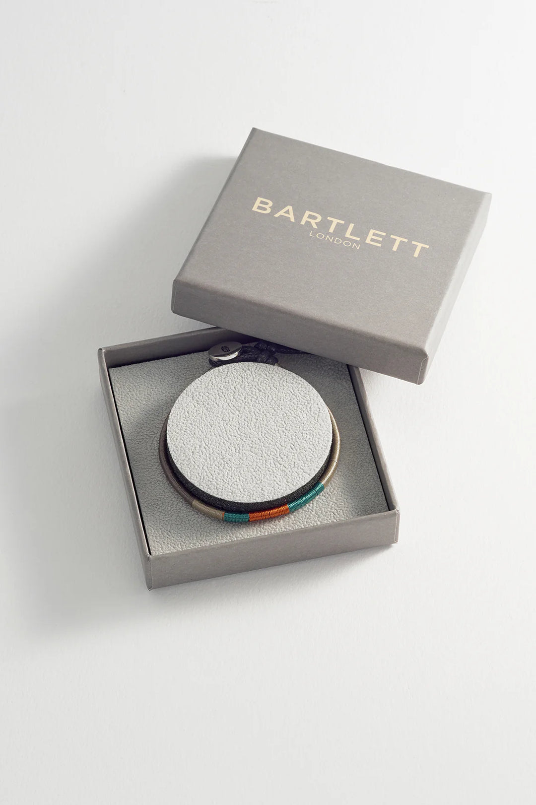 Bartlett London men’s woven bracelet in waterproof stainless steel with navy, red and mustard thread details