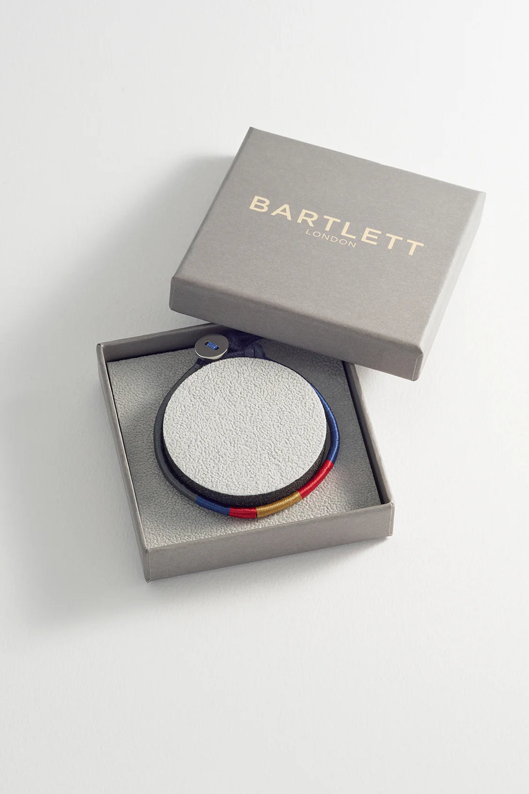 Bartlett London men’s woven bracelet in waterproof stainless steel with navy, red and mustard thread details