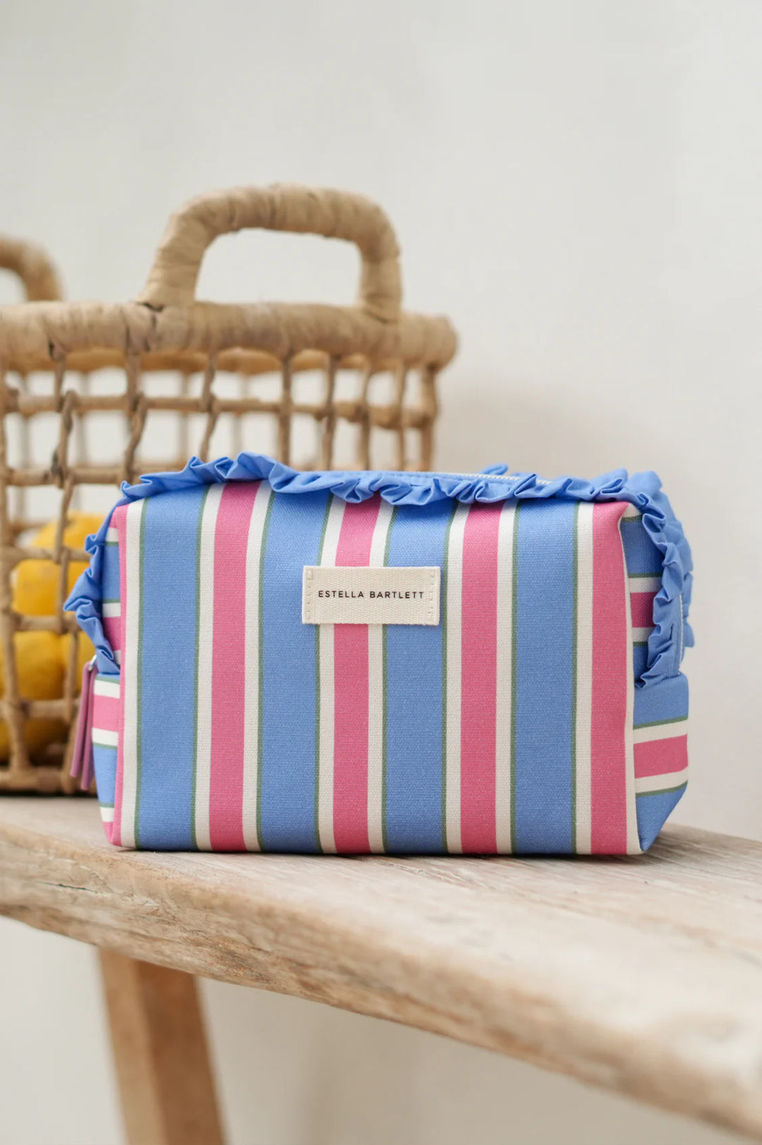 Estella Bartlett green stripe ruffle wash bag with colourful striped pattern and frill trim