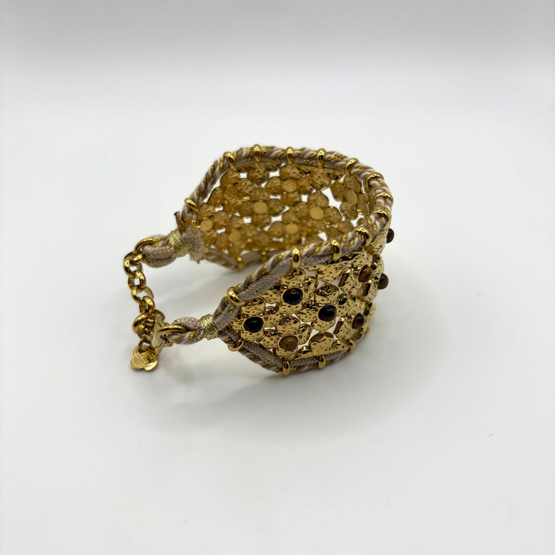 Habaha gold statement cuff bracelet with intricate floral openwork design and decorative gemstone accents