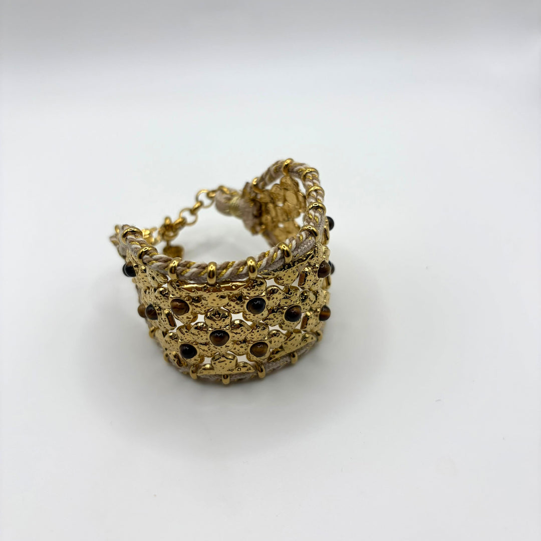 Habaha gold statement cuff bracelet with intricate floral openwork design and decorative gemstone accents