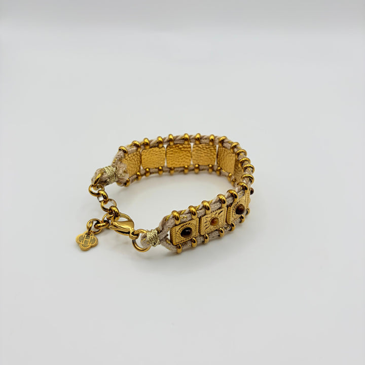 Habaha gold bohemian bracelet with textured metal details, woven cord and natural stone accents