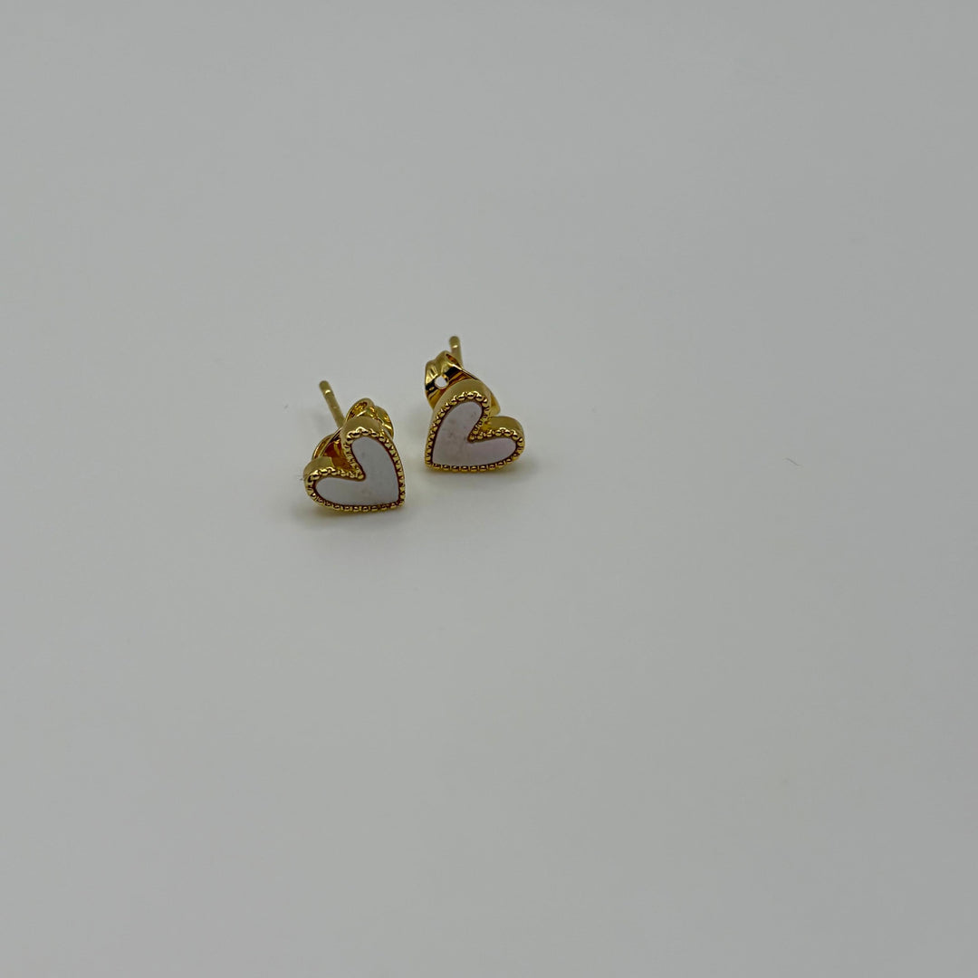 Habaha heart stud earrings with white mother-of-pearl effect inlay and gold-plated finish on a white background
