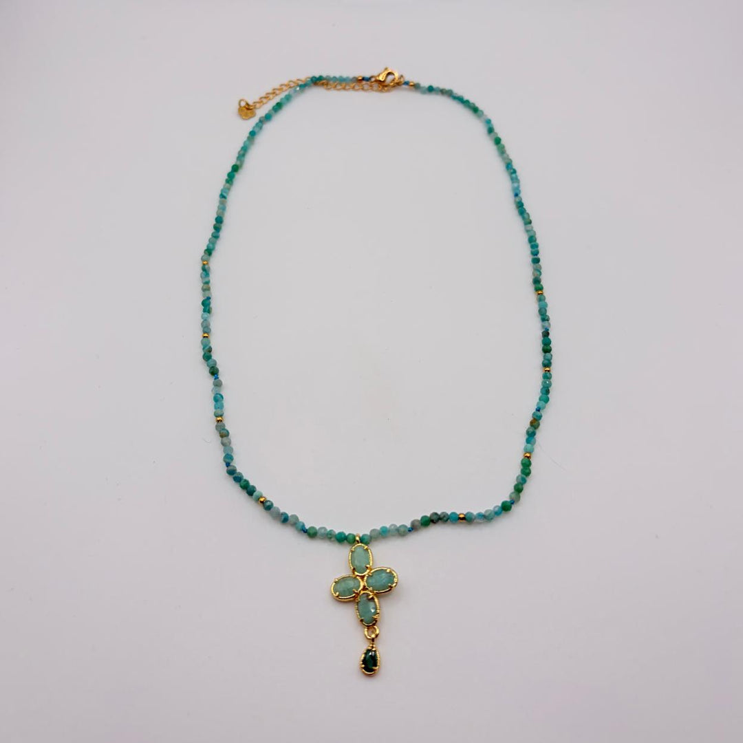 Azura turquoise cross pendant necklace with blue-green beads and gold-tone details by Habaha