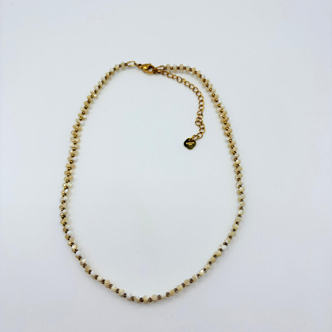 Elara ivory and gold beaded necklace with delicate faceted beads and gold-tone accents by Habaha