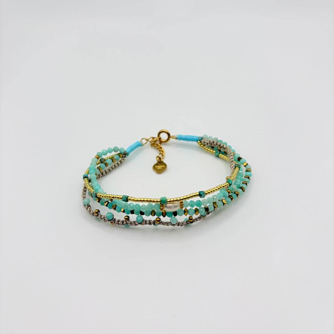 Nayeli turquoise multi-strand bracelet with layered beads, gold-tone accents and pearl-inspired detail by Habaha