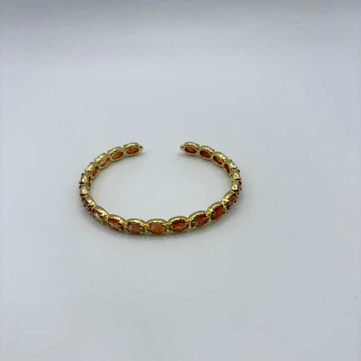 Habaha gold cuff bracelet with multicolor gemstone accents and textured finish