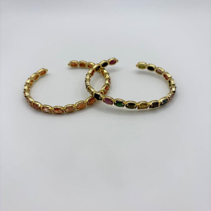 Habaha gold cuff bracelet with multicolor gemstone accents and textured finish