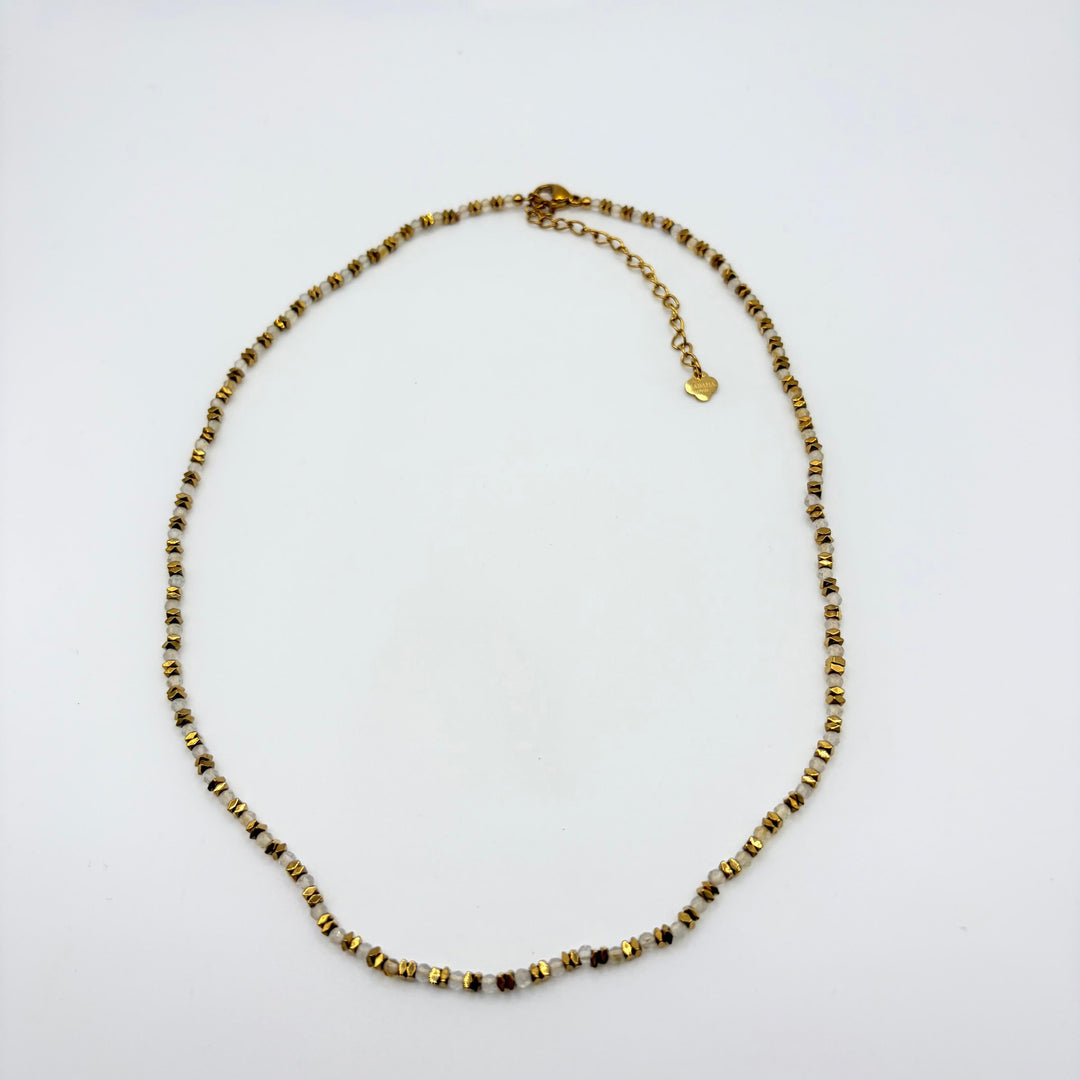 Sienna gold beaded necklace with delicate beige, brown and cream beads and gold-tone accents by Habaha