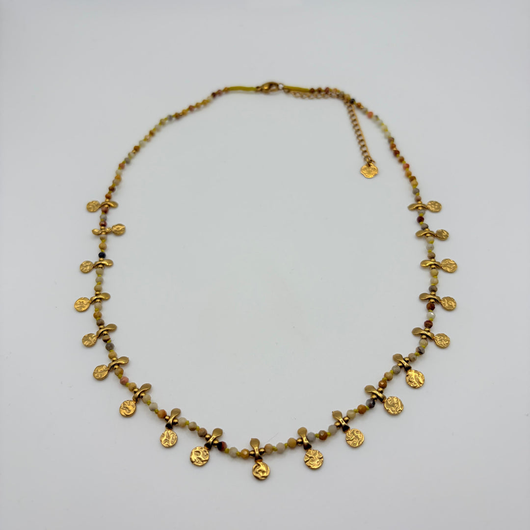 Solena gold coin beaded necklace with neutral faceted beads and textured gold-tone charms by Habaha