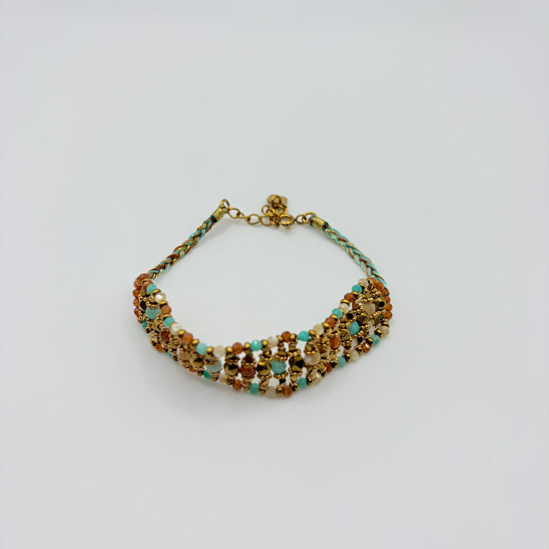 Zahara turquoise woven beaded bracelet with amber, cream and gold-tone details by Habaha