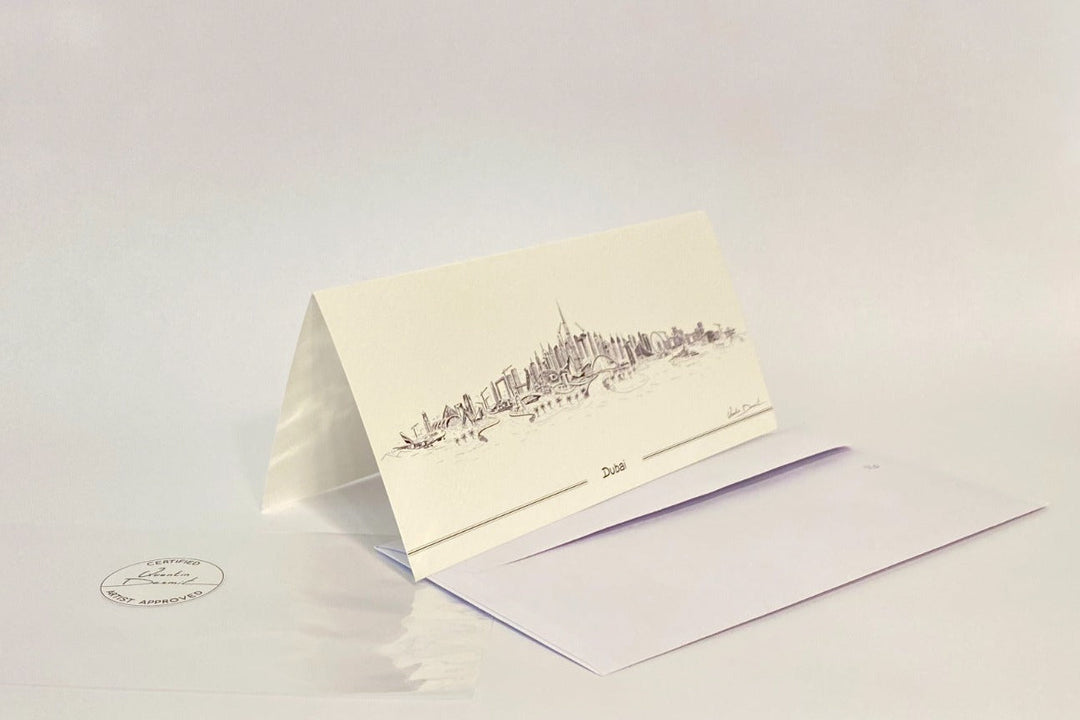 Dubai skyline illustrated folded greeting card with white envelope and minimalist luxury stationery design.