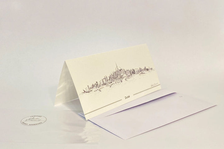 Dubai skyline illustrated folded greeting card with white envelope and minimalist luxury stationery design.