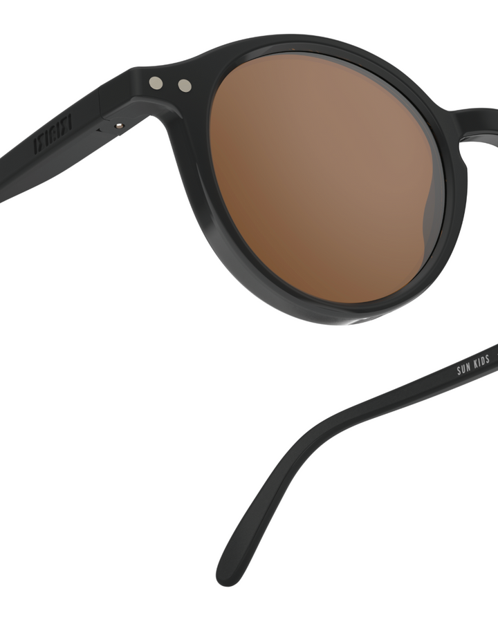 Round kids sunglasses for ages 3 to 5 with black frame by Izipizi