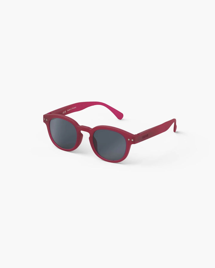 IZIPIZI CHILD #C Cranberry polarized kids sunglasses with shiny pink frame, grey-green lenses and 100% UV protection