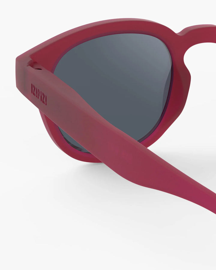 IZIPIZI CHILD #C Cranberry polarized kids sunglasses with shiny pink frame, grey-green lenses and 100% UV protection