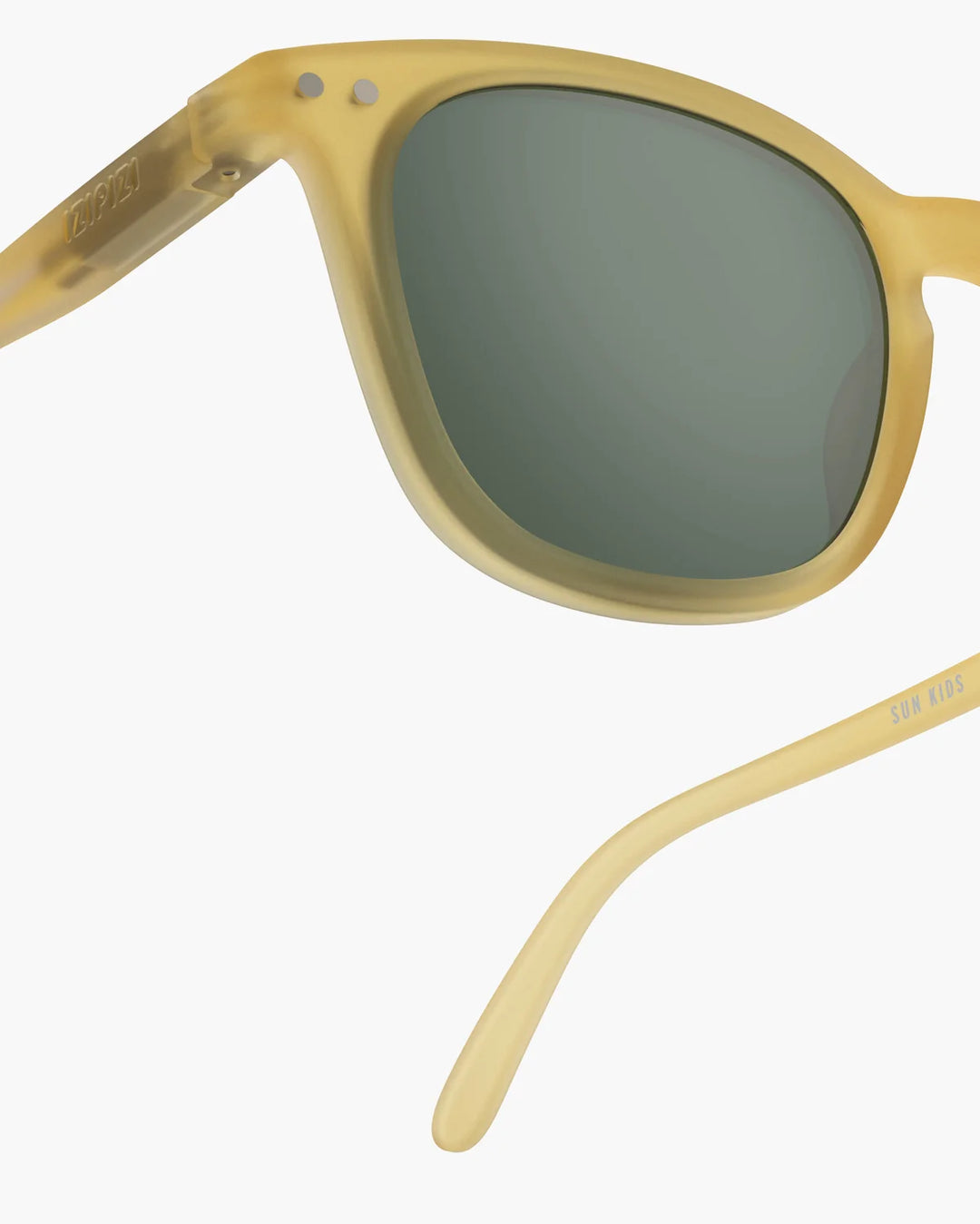 IZIPIZI CHILD #E Yellow Honey polarized kids sunglasses with translucent yellow frame and green polarized lenses