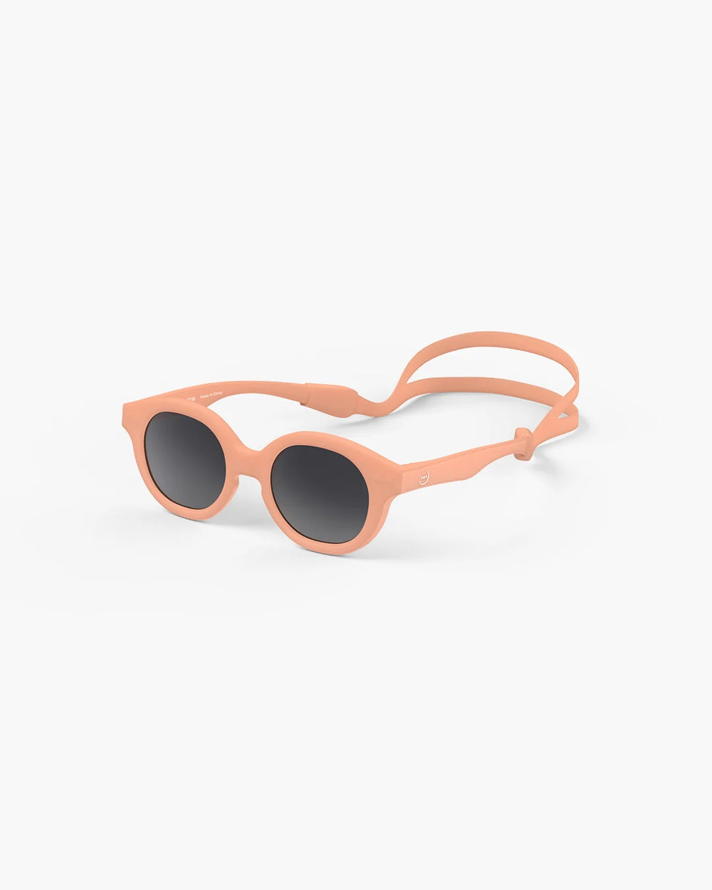 IZIPIZI Baby #C Apricot polarized sunglasses for children aged 0–3 years with matte peach frame and grey lenses