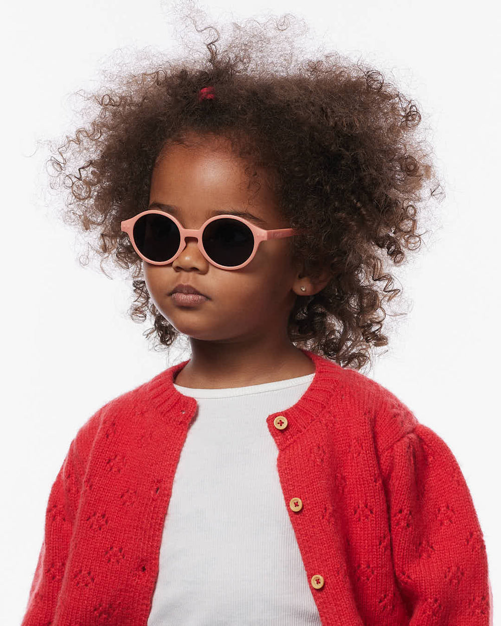 IZIPIZI Baby #D Apricot polarized sunglasses for toddlers aged 0–3 with a soft peach matte frame and grey lenses