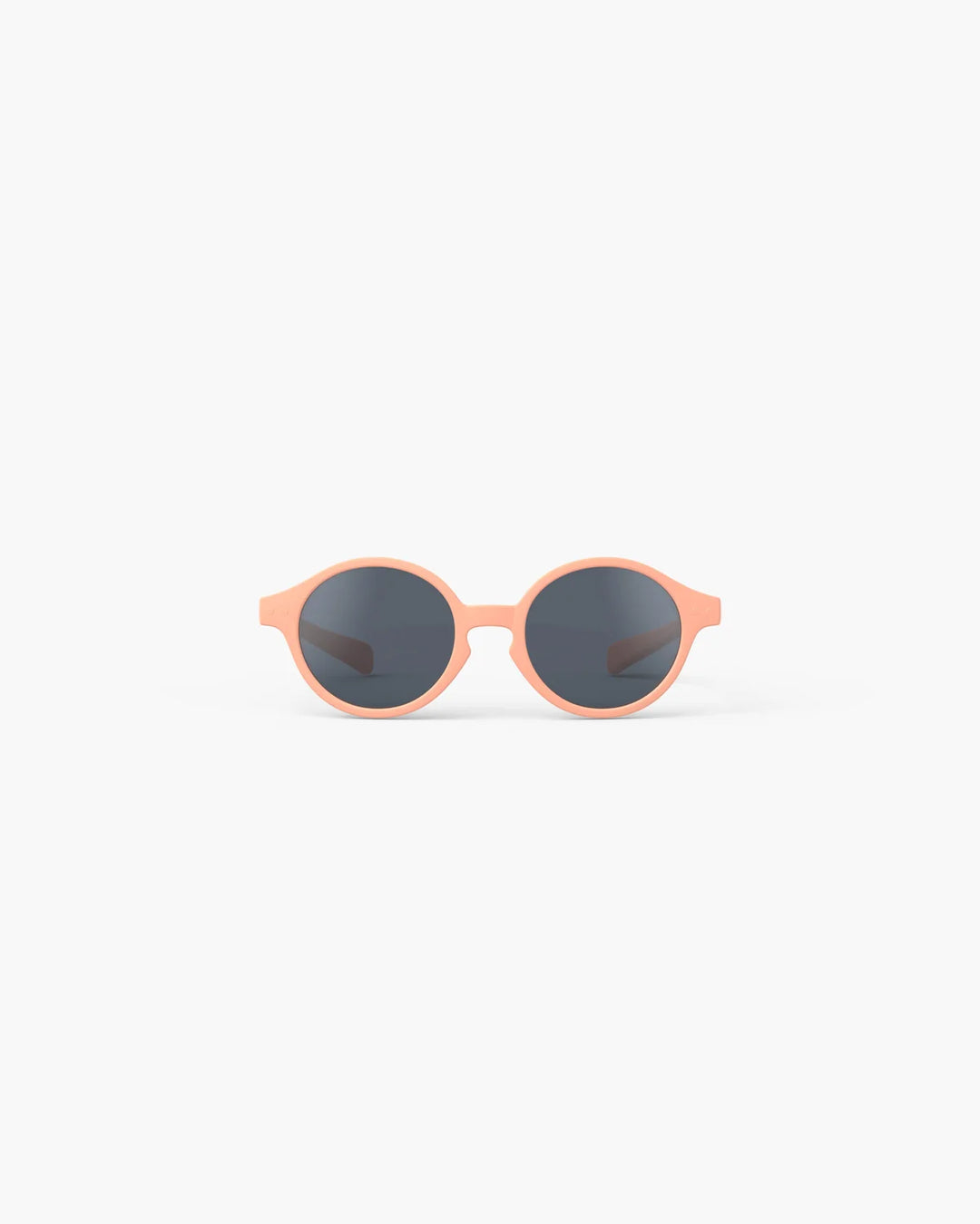 IZIPIZI Baby #D Apricot polarized sunglasses for toddlers aged 0–3 with a soft peach matte frame and grey lenses